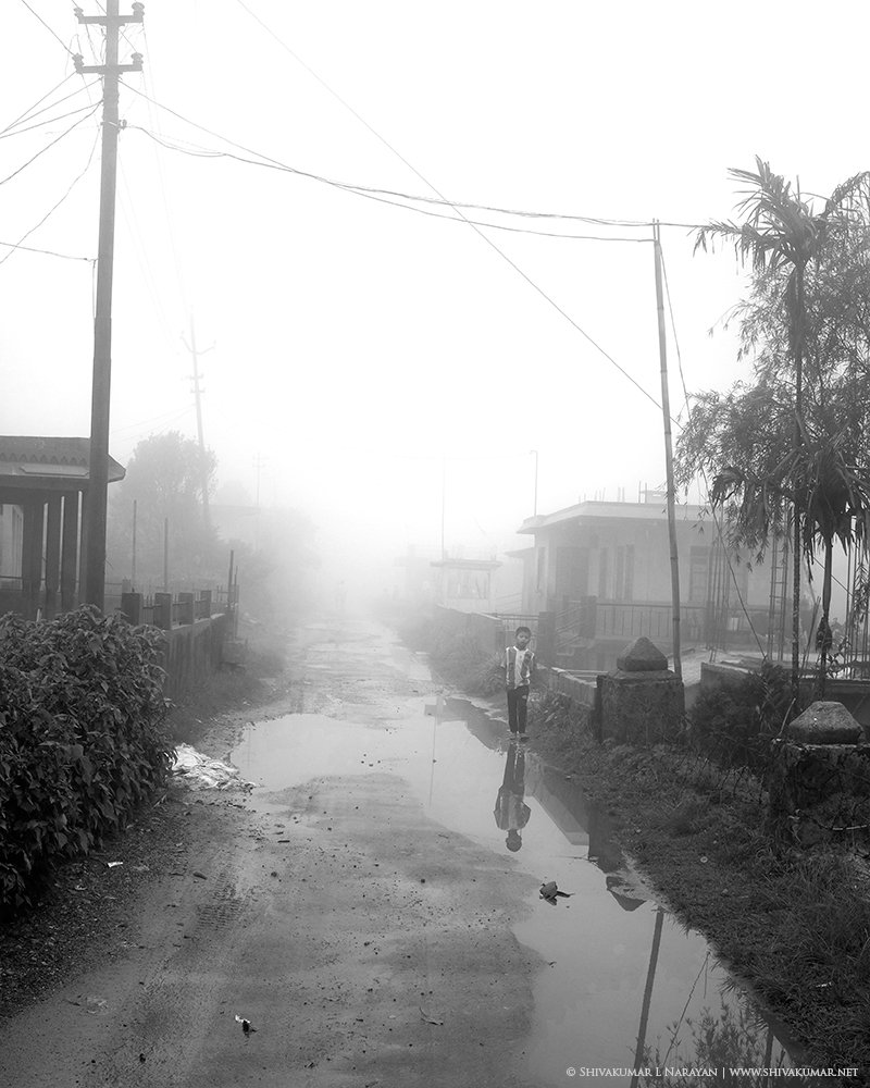 Boy walking on a misty morning in Cheerapunji Meghalaya